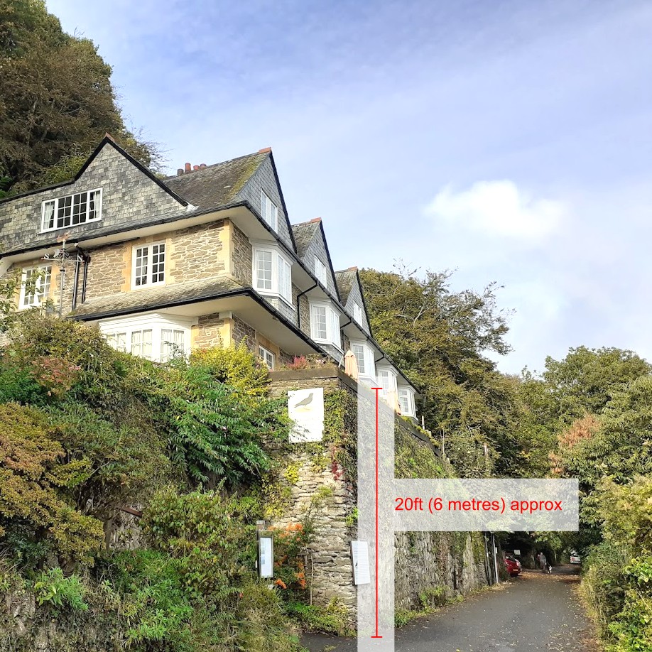 Photo showing elevation of Chough's Nest hotel building above road