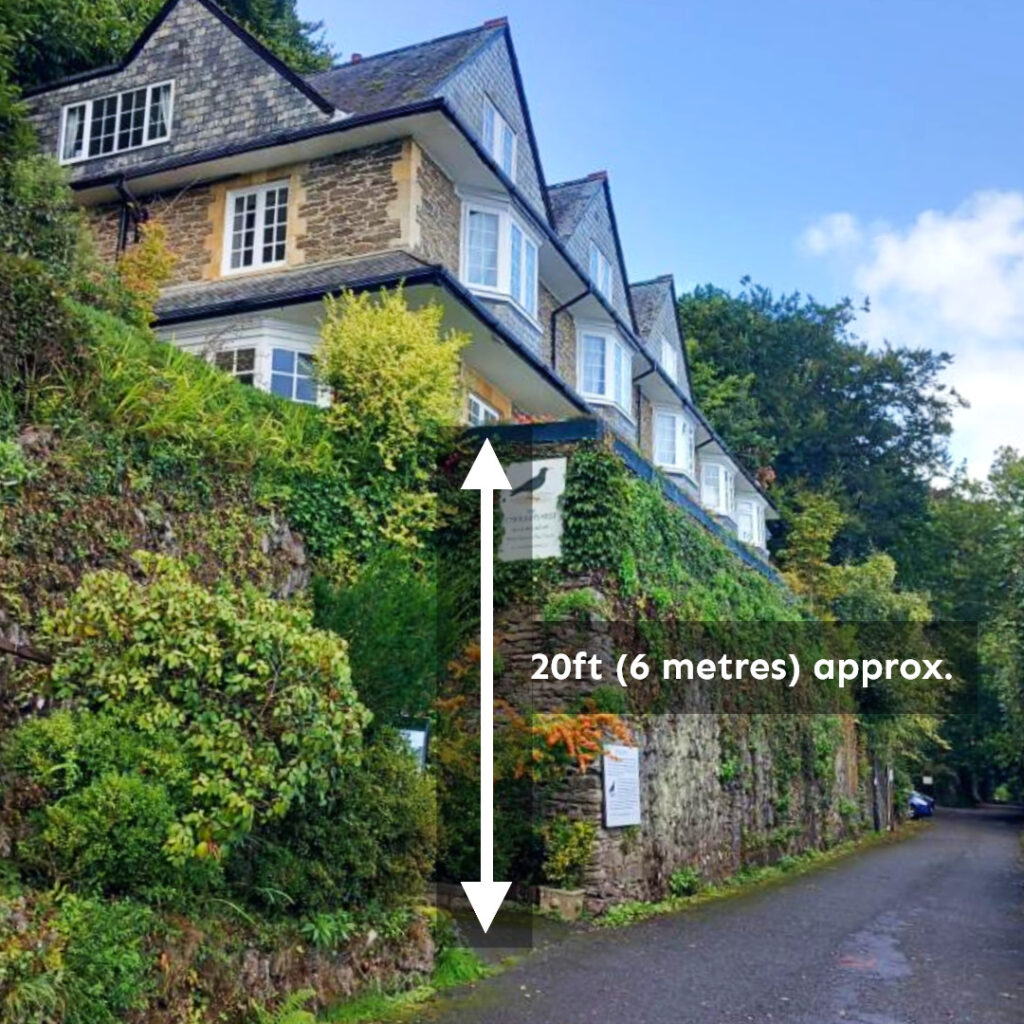 Photo showing elevation of Chough's Nest hotel building above road