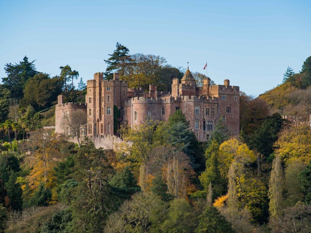 Dunster Castle (National Trust property) overlooking the medieval village in Somerset