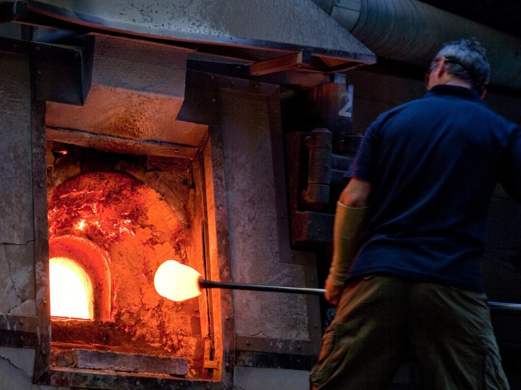Glassmakers creating handcrafted crystal at Dartington Crystal in Great Torrington, North Devon